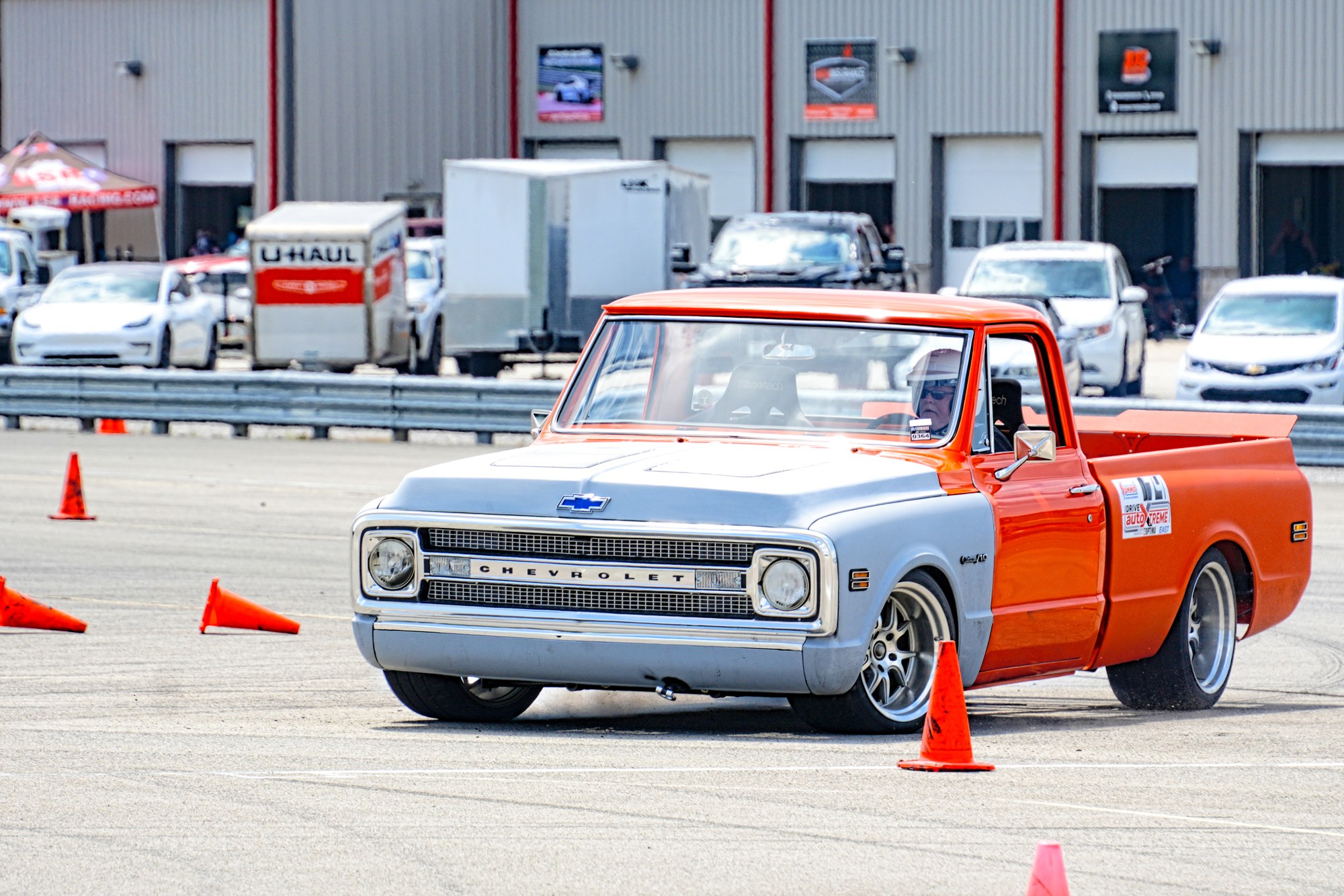 Orange pickup navigating the cones