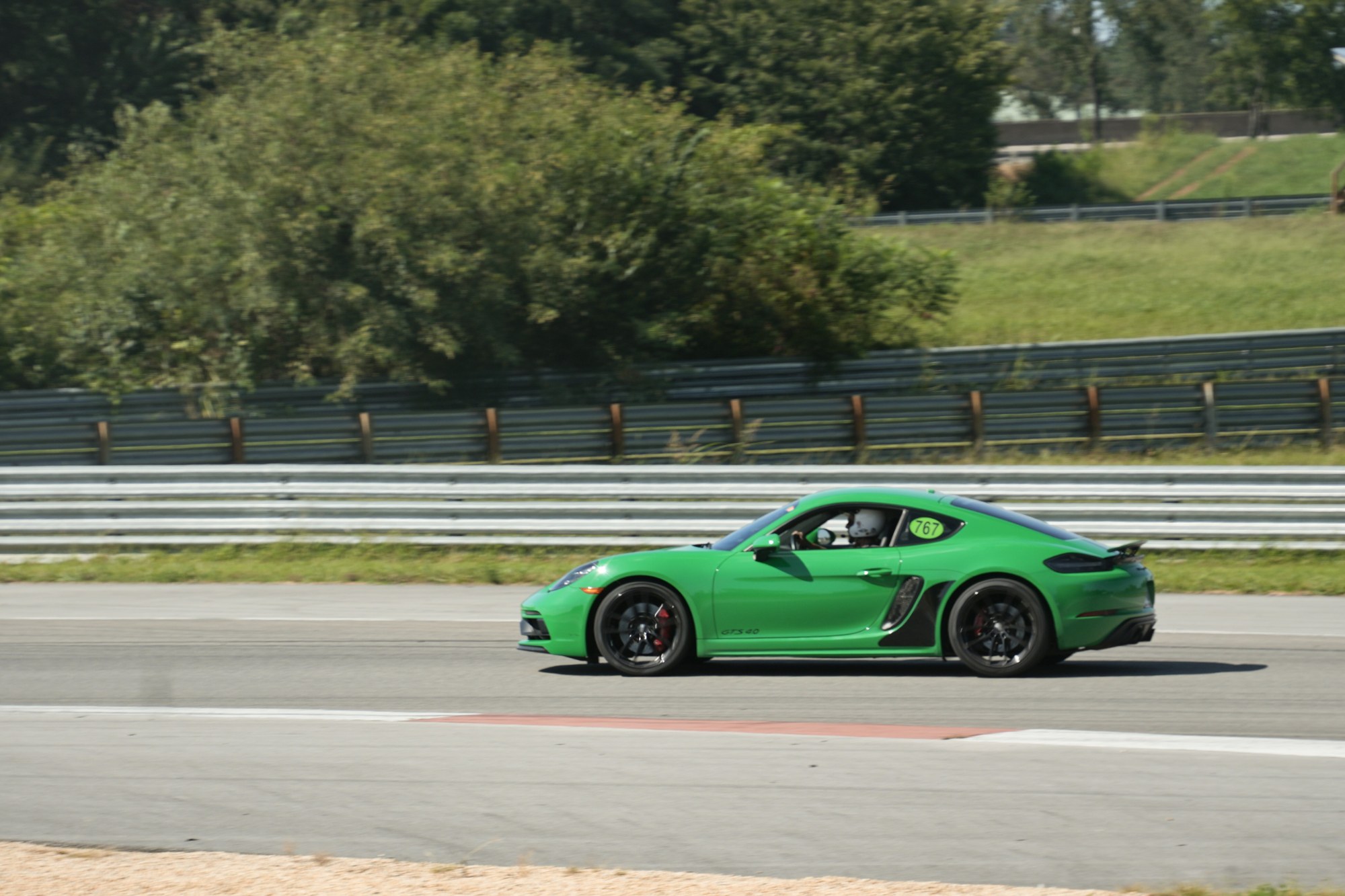 Green Porsche on track